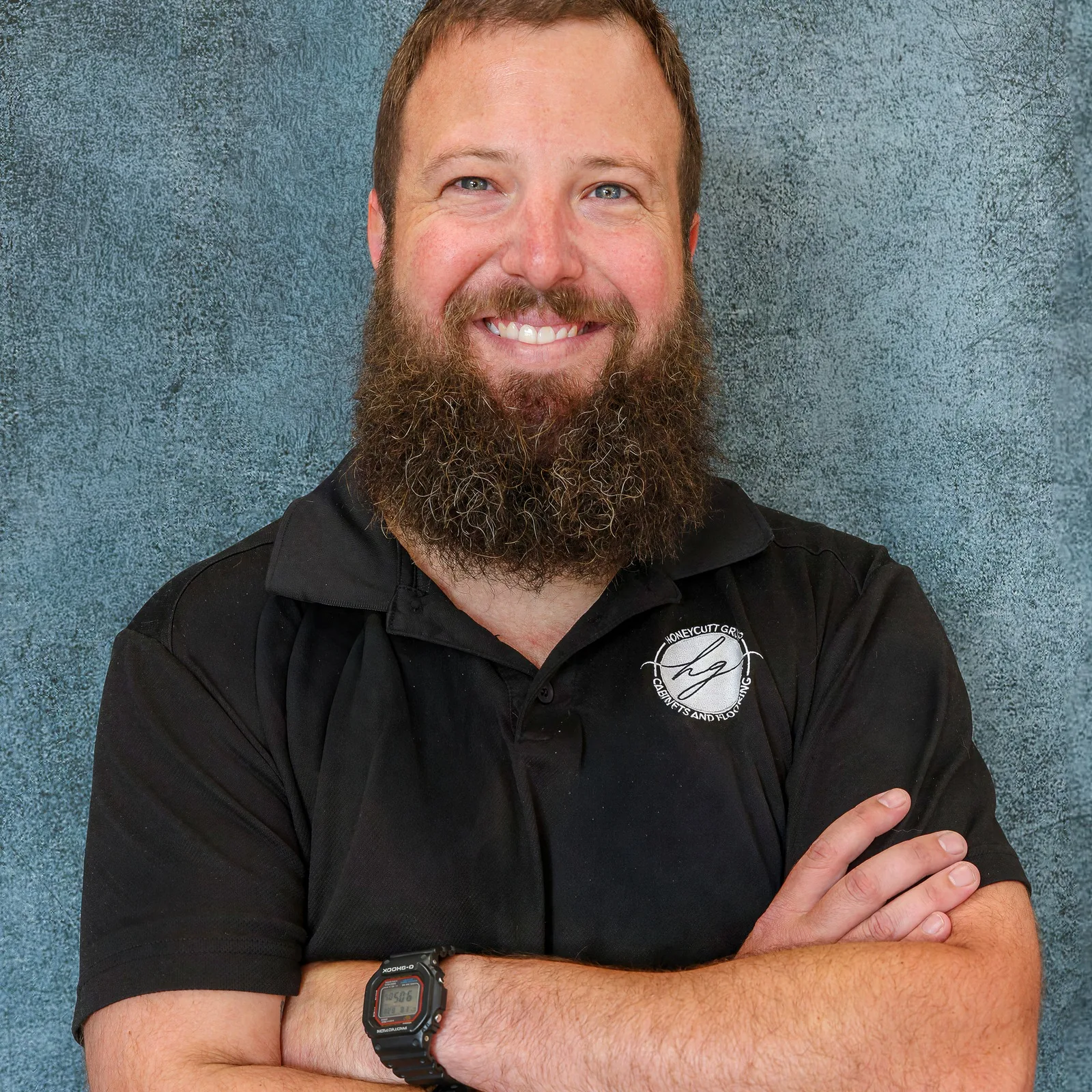 Dylan Whitley, Sales Representative at Honeycutt Group, smiling with arms crossed