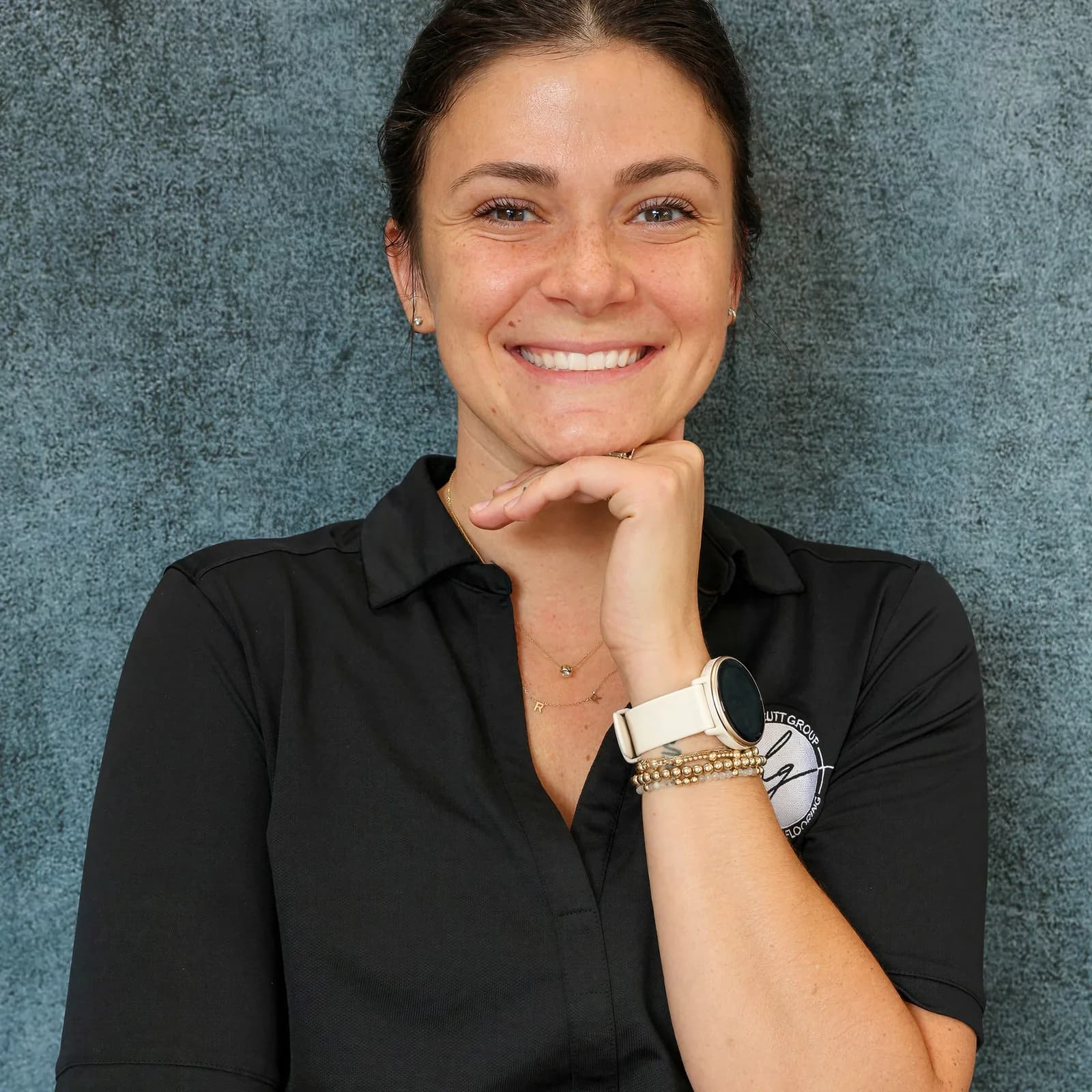 Lianna Honeycutt, Accountant at Honeycutt Group, smiling with hand on chin