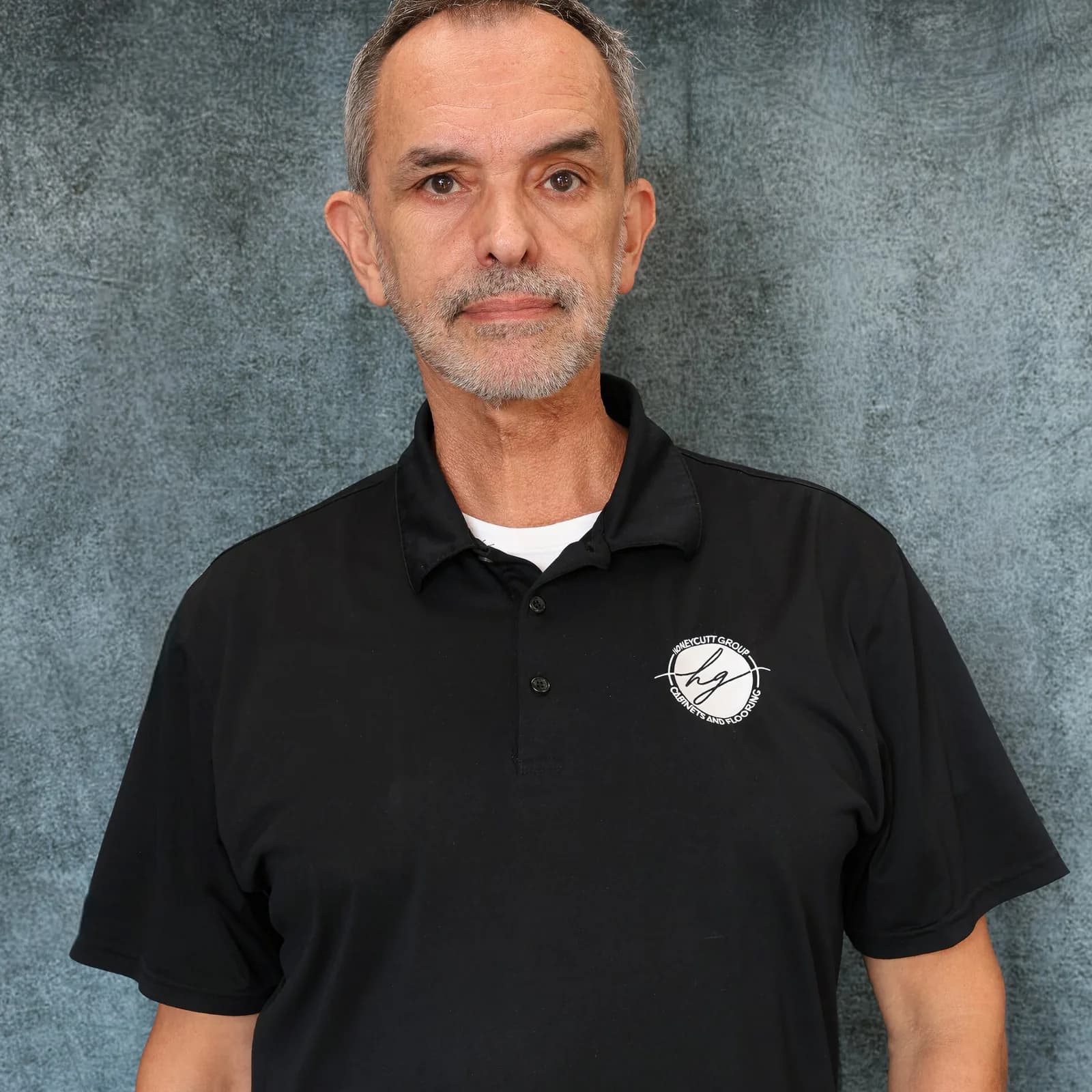 Mario Cabral, Project Manager at Honeycutt Group, in a black polo