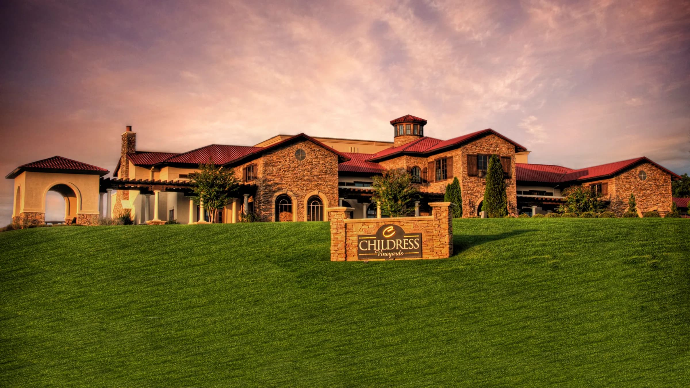 Childress Vineyards building with red roofs and a sunset sky