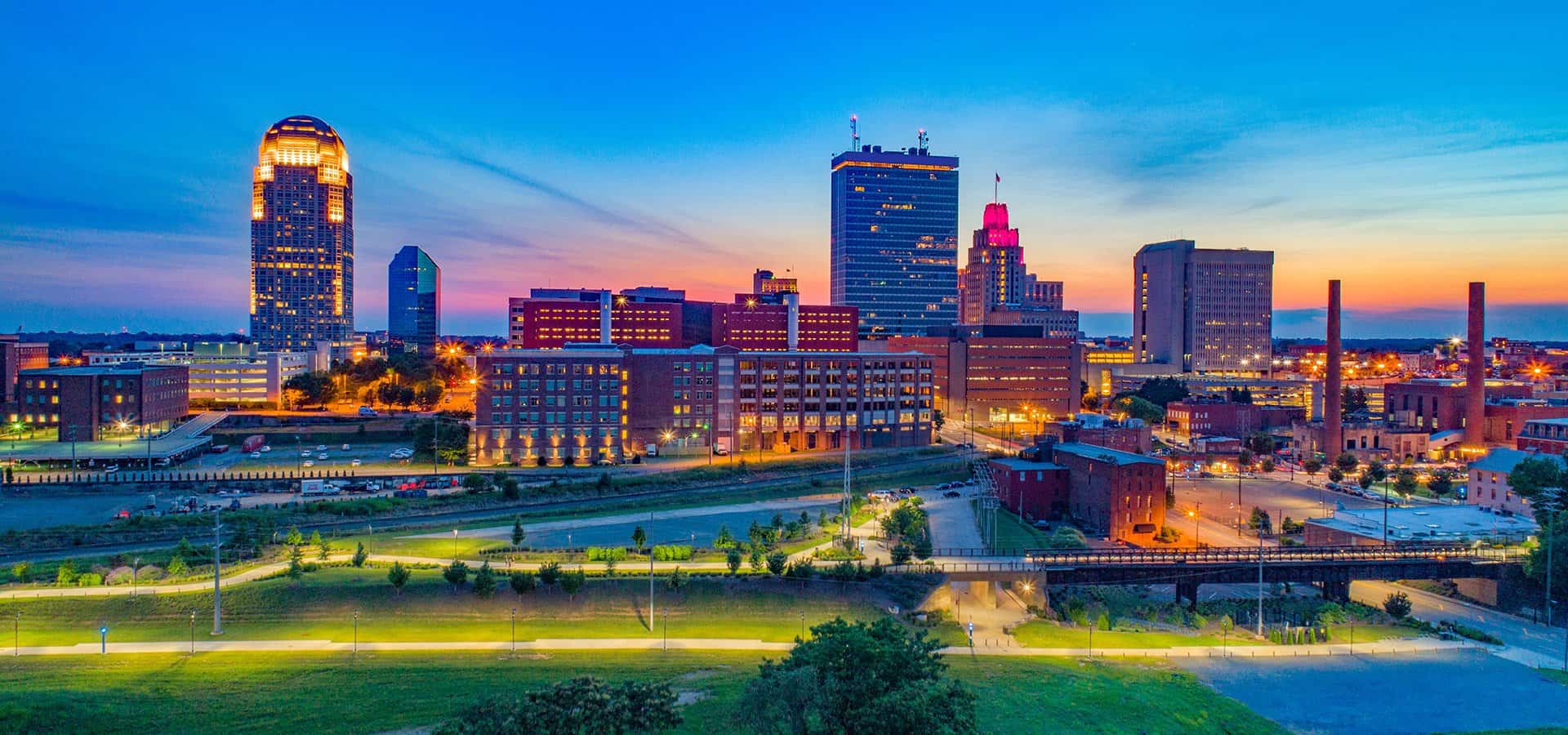 Winston-Salem skyline view at sunset showing downtown buildings and urban landscape