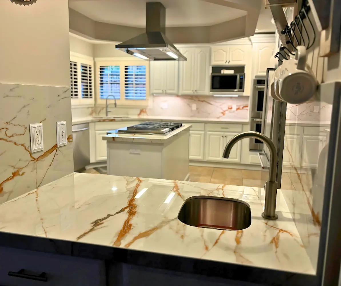 Dekton countertop with gold veining and undermount sink