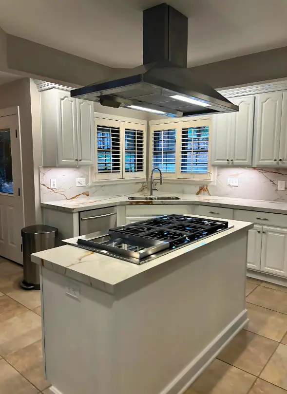 Classic kitchen design showcasing Dekton Awake countertops with white cabinetry and modern appliances.