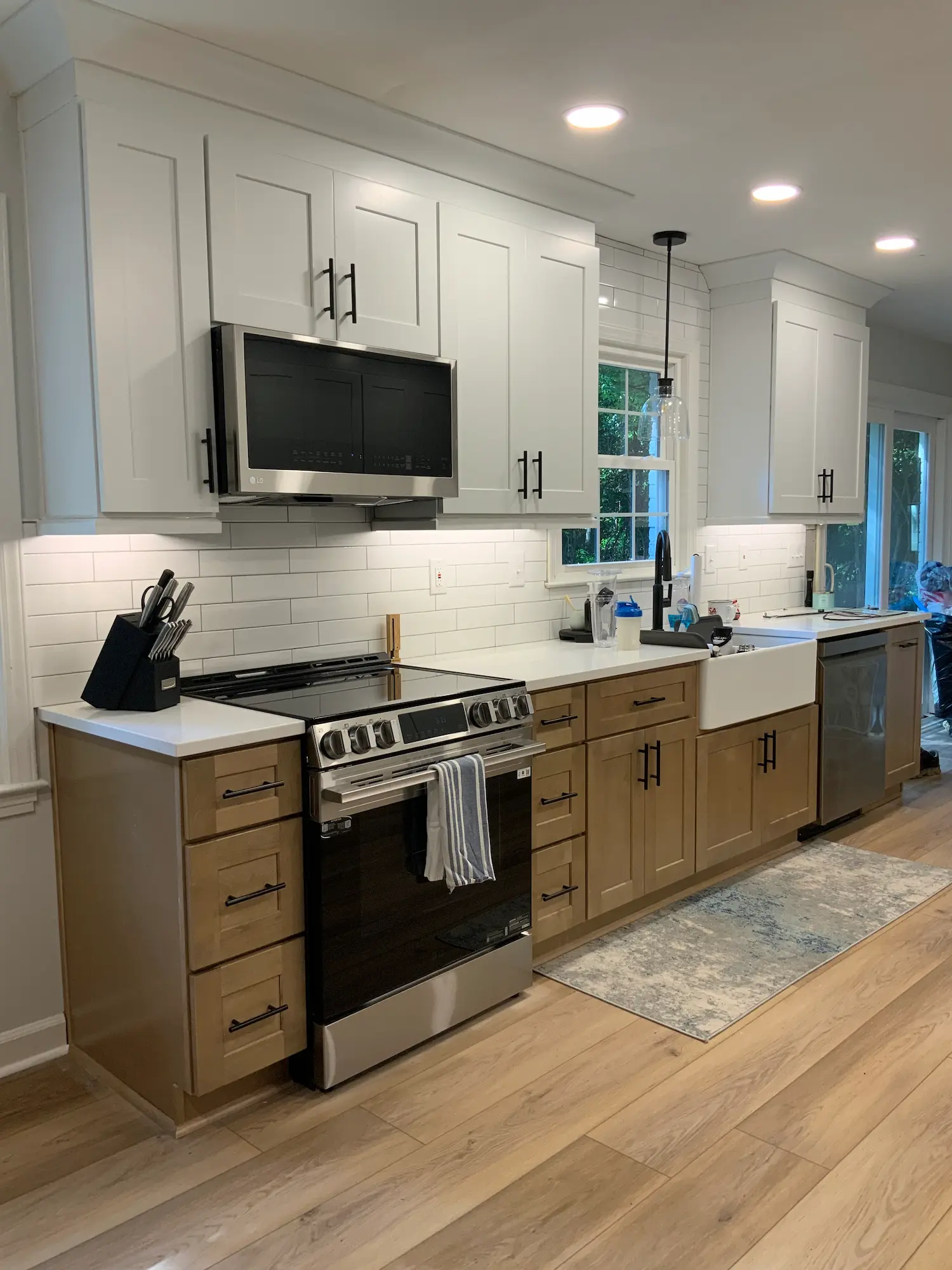 Modern shaker style kitchen remodel in Charlotte with white cabinetry and granite countertops