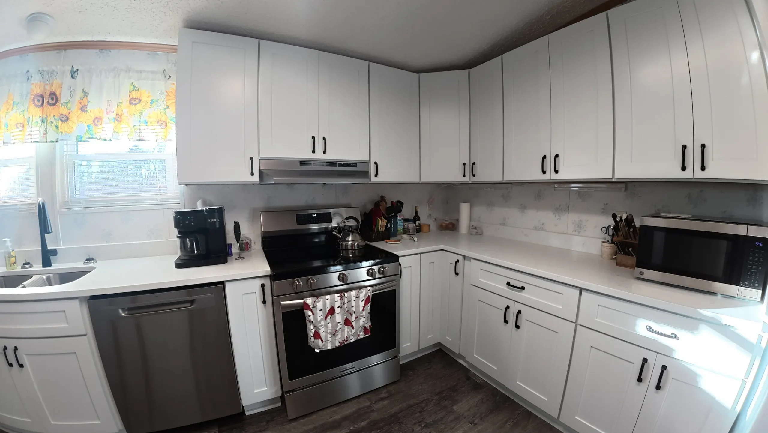 White cabinets with slide-in range and over-range microwave